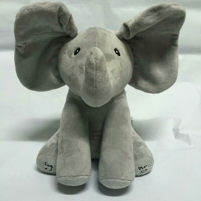 Sbirciata grigia giocattoli di fischio di una peluche di musica, giocattolo farcito elettronico dell'elefante