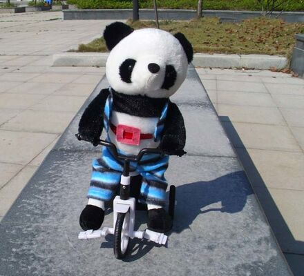 Giocattoli musicali della peluche del cotone di 100% pp, giocattolo molle del panda animale elettronico della bicicletta