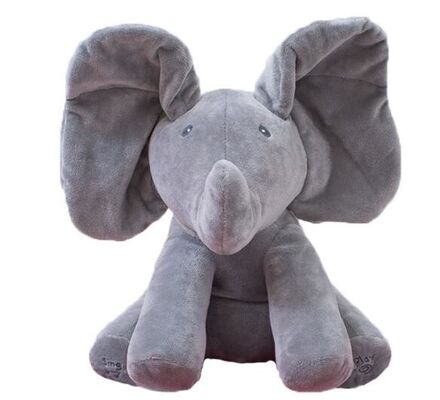 La sbirciata musicale un elefante di fischio gioca a nascondino i giocattoli coccoli della peluche del bambino elettrico