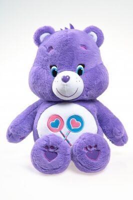 La cura originale sopporta i giocattoli della peluche del fumetto degli animali farciti, porpora/blu/giallo